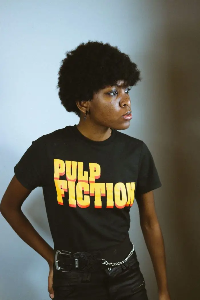 woman wearing pulp fiction shirt